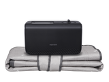 User sleeping comfortably on a water heated mattress pad in a cozy bedroom